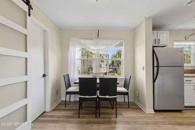 925 Tarpon Ave Unit 16, Fernandina Beach, FL 32034 - dining area with light wood-type flooring and baseboards