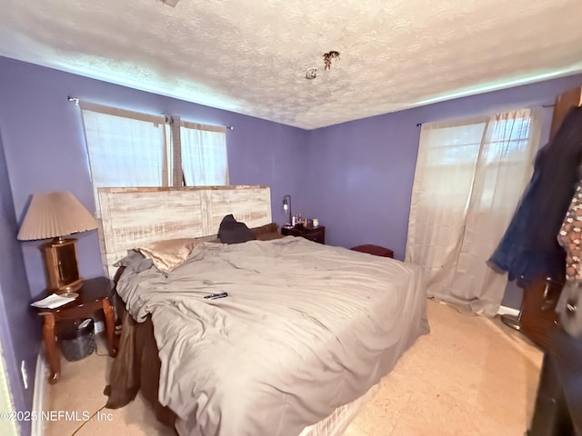4507 Harbor View Dr, Jacksonville, FL 32208 - bedroom with multiple windows, carpet, and a textured ceiling