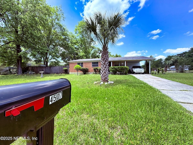 4507 Harbor View Dr, Jacksonville, FL 32208 - ranch-style house with an attached carport and driveway