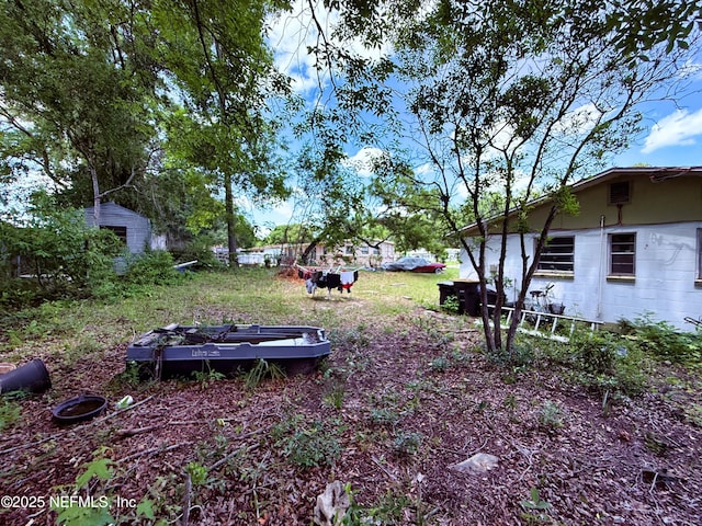 4507 Harbor View Dr, Jacksonville, FL 32208 - view of yard with a storage shed and an outdoor structure