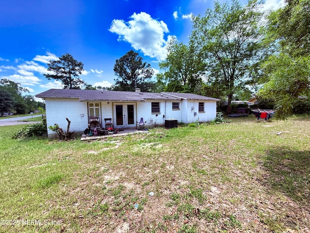 4507 Harbor View Dr, Jacksonville, FL 32208 - view of front facade with french doors, a front yard, and a patio
