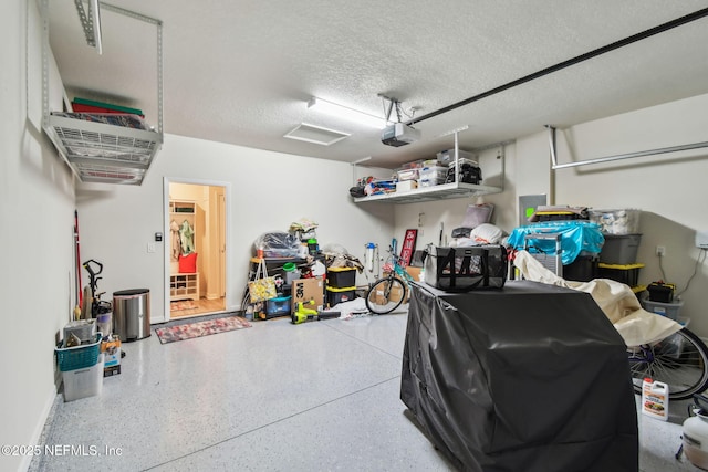 garage featuring a garage door opener