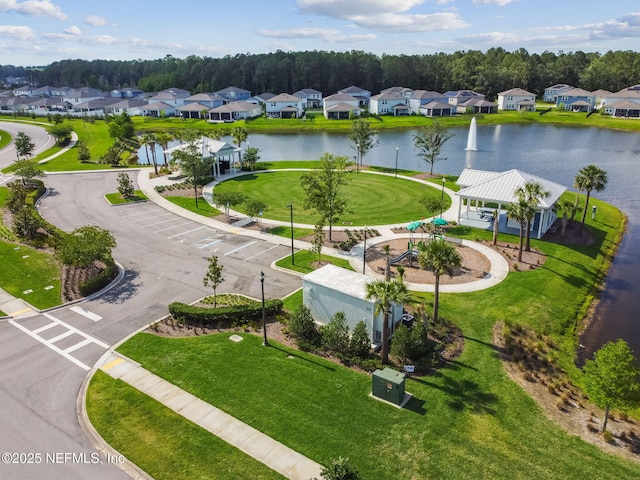 aerial view of residential area featuring a nearby body of water