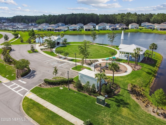 aerial perspective of suburban area with a nearby body of water