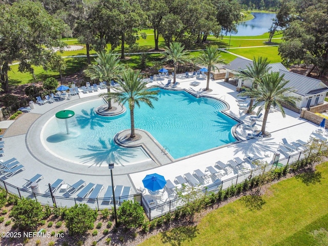 community pool featuring a water view and a patio