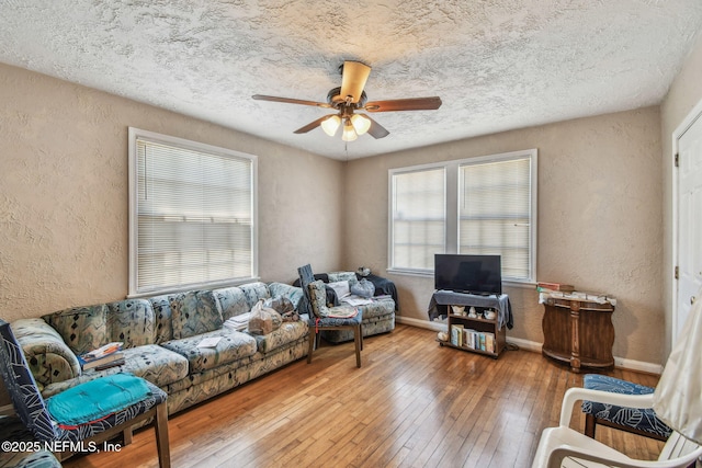 2660 Gale Ct, Jacksonville, FL 32204 - living area featuring a textured wall, ceiling fan, hardwood / wood-style flooring, a textured ceiling, and baseboards