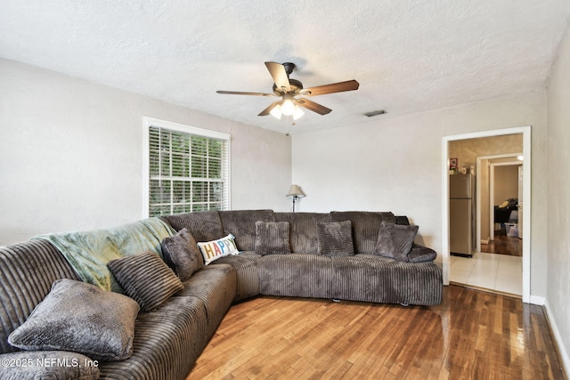 2660 Gale Ct, Jacksonville, FL 32204 - living room with wood-type flooring, ceiling fan, and a textured ceiling