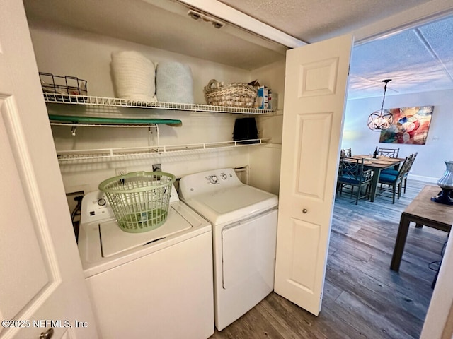 3240 Fletcher Ave Unit 665, Fernandina Beach, FL 32034 - laundry area with washer and clothes dryer and dark wood-type flooring