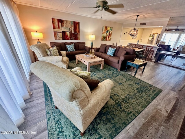 3240 Fletcher Ave Unit 665, Fernandina Beach, FL 32034 - living area featuring a ceiling fan, wood finished floors, and a textured ceiling