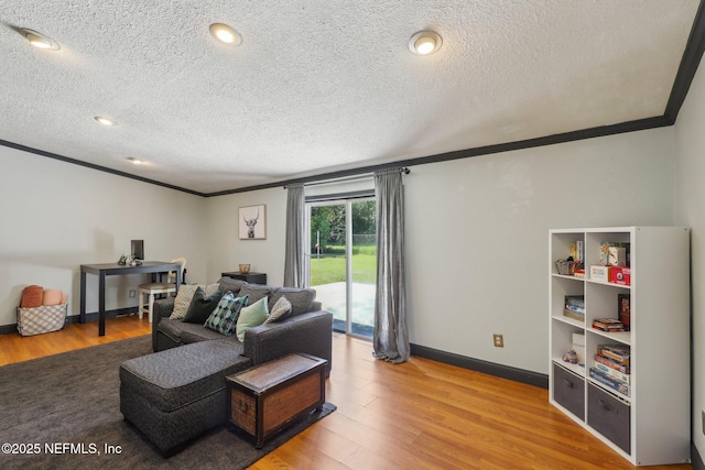 4033 Lazy Hollow Ln N, Jacksonville, FL 32257 - living area featuring ornamental molding, light wood-style flooring, a textured ceiling, and baseboards