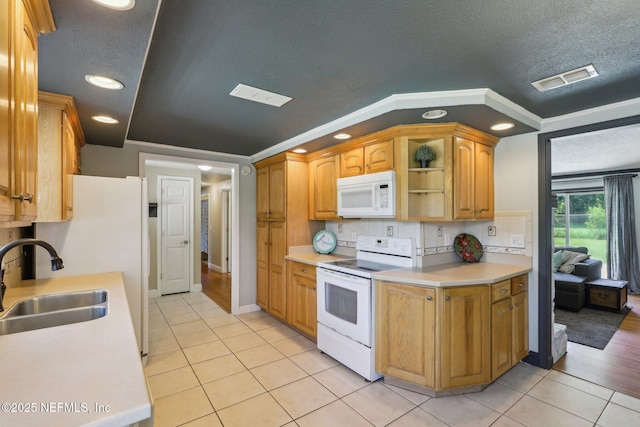 4033 Lazy Hollow Ln N, Jacksonville, FL 32257 - kitchen featuring white appliances, a sink, light countertops, light tile patterned floors, and a textured ceiling
