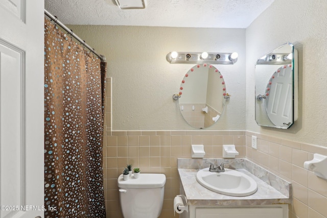 4033 Lazy Hollow Ln N, Jacksonville, FL 32257 - bathroom featuring toilet, vanity, tile walls, curtained shower, and wainscoting