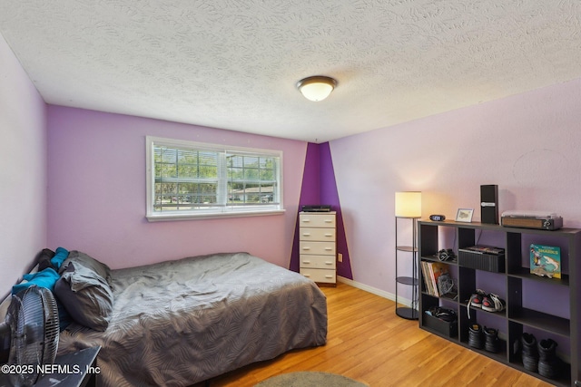 4033 Lazy Hollow Ln N, Jacksonville, FL 32257 - bedroom with wood finished floors and a textured ceiling