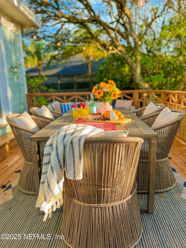 deck featuring outdoor dining area
