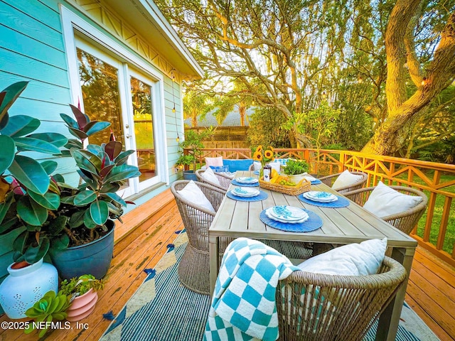 deck with outdoor dining space