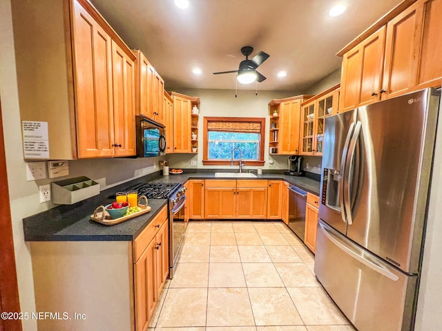 kitchen featuring appliances with stainless steel finishes, open shelves, a sink, dark countertops, and ceiling fan