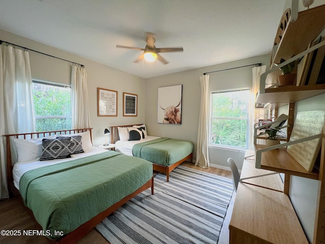 bedroom with wood finished floors and ceiling fan