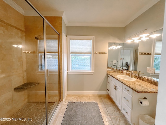 bathroom featuring a stall shower, ornamental molding, healthy amount of natural light, and vanity