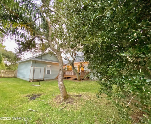 view of yard featuring a wooden deck