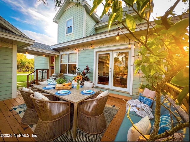 deck featuring french doors and outdoor dining area