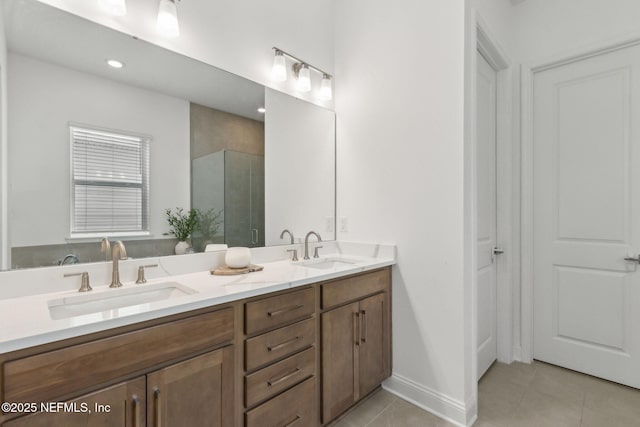 355 Caiden Dr, Ponte Vedra, FL 32081 - bathroom featuring double vanity, tile patterned flooring, a shower stall, recessed lighting, and baseboards