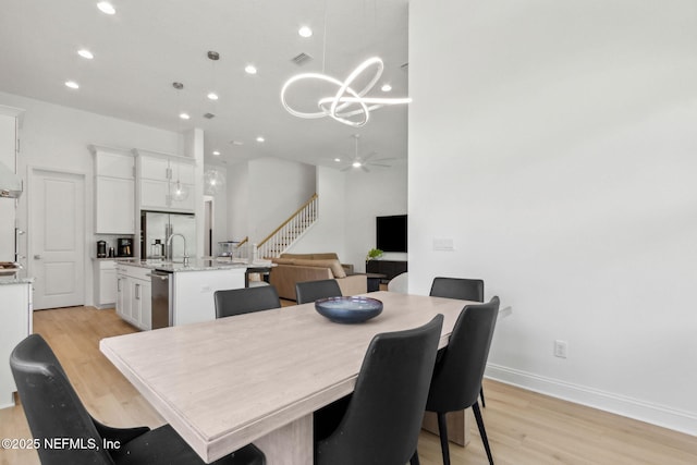 355 Caiden Dr, Ponte Vedra, FL 32081 - dining room with a chandelier, light wood finished floors, recessed lighting, and baseboards