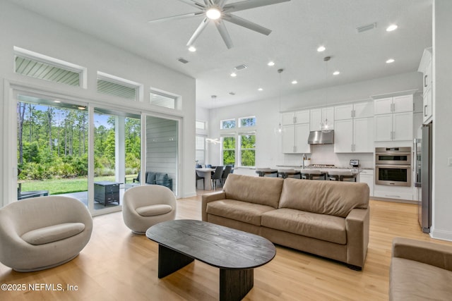 355 Caiden Dr, Ponte Vedra, FL 32081 - living room featuring recessed lighting, a ceiling fan, light wood-type flooring, and a towering ceiling