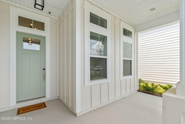 355 Caiden Dr, Ponte Vedra, FL 32081 - doorway to property featuring board and batten siding, a porch, elevator, and a security system