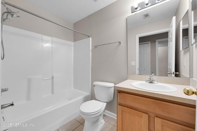 13856 Herons Landing Way Unit 11-7, Jacksonville, FL 32224 - full bath featuring tile patterned floors, toilet,  shower combination, a textured ceiling, and vanity