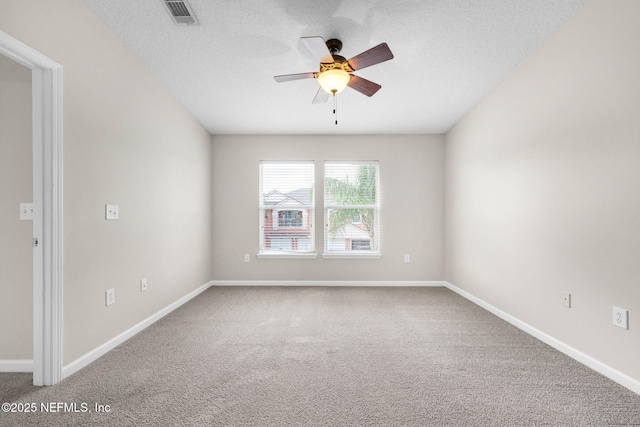 13856 Herons Landing Way Unit 11-7, Jacksonville, FL 32224 - empty room featuring a ceiling fan, carpet, baseboards, and a textured ceiling