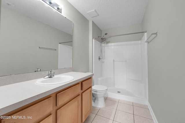 13856 Herons Landing Way Unit 11-7, Jacksonville, FL 32224 - full bathroom featuring tile patterned floors, toilet, vanity, a shower, and a textured ceiling
