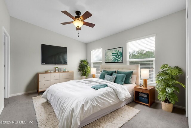 13856 Herons Landing Way Unit 11-7, Jacksonville, FL 32224 - bedroom with light carpet, vaulted ceiling, baseboards, and ceiling fan
