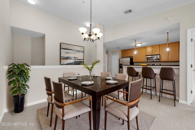 13856 Herons Landing Way Unit 11-7, Jacksonville, FL 32224 - dining space featuring a chandelier and baseboards