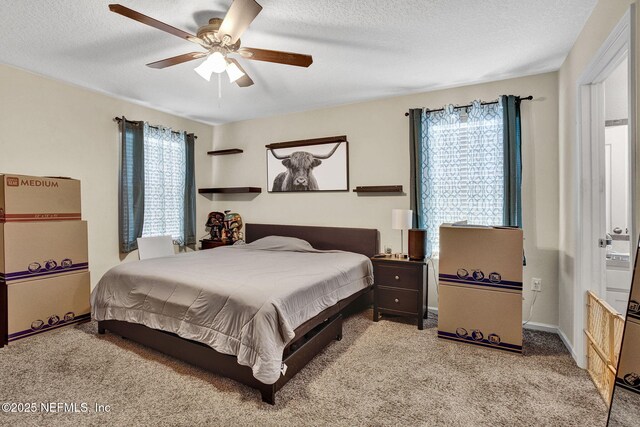 2465 Oak Stream Dr, Green Cove Springs, FL 32043 - bedroom with multiple windows, carpet floors, a textured ceiling, a ceiling fan, and baseboards