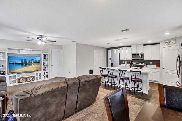 2465 Oak Stream Dr, Green Cove Springs, FL 32043 - living area featuring ceiling fan, dark wood-type flooring, and recessed lighting
