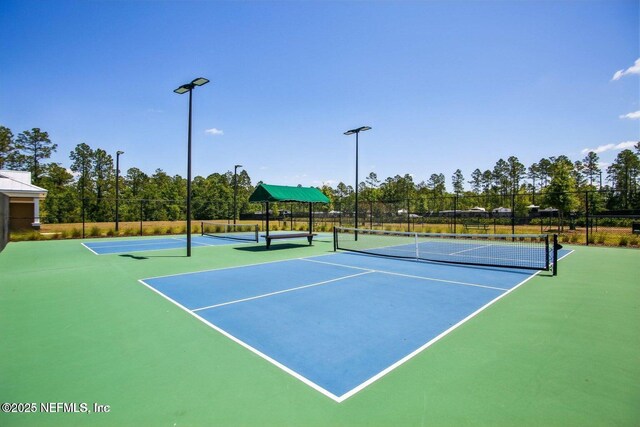 2465 Oak Stream Dr, Green Cove Springs, FL 32043 - view of tennis court with community basketball court and fence