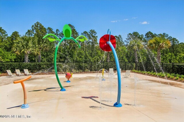 2465 Oak Stream Dr, Green Cove Springs, FL 32043 - view of playground featuring fence and view of scattered trees