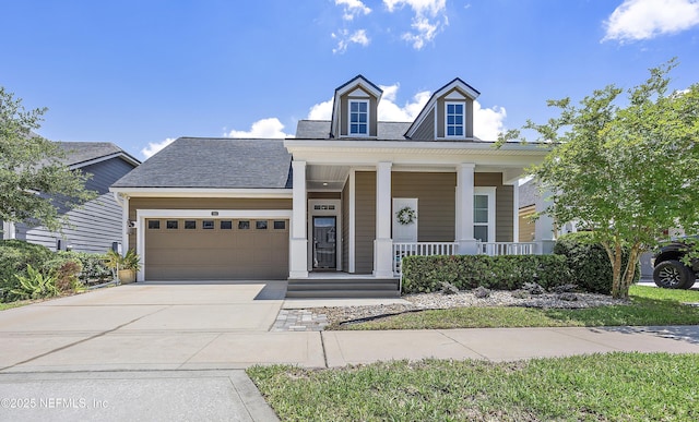 285 Yearling Blvd, Saint Johns, FL 32259 - view of front facade with a porch, an attached garage, concrete driveway, and roof with shingles