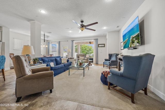 285 Yearling Blvd, Saint Johns, FL 32259 - living area featuring a ceiling fan, a textured ceiling, decorative columns, carpet flooring, and baseboards