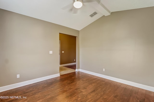 spare room with a ceiling fan, wood finished floors, and baseboards
