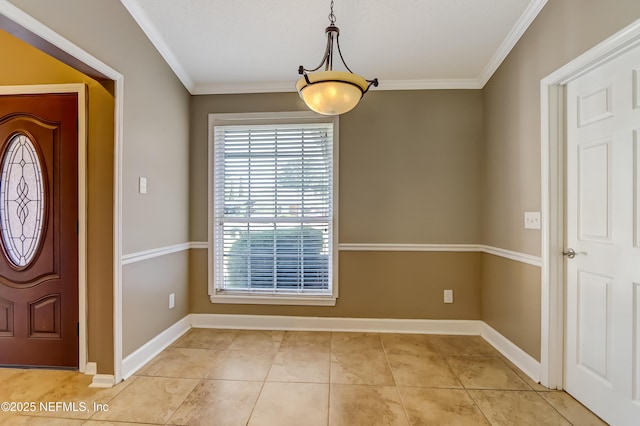 foyer with crown molding, baseboards, and light tile patterned floors