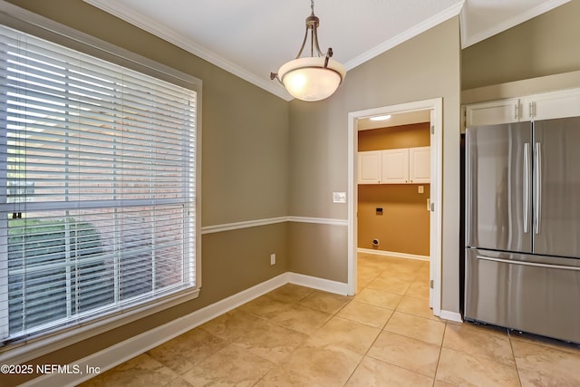 unfurnished dining area with crown molding, light tile patterned flooring, and baseboards