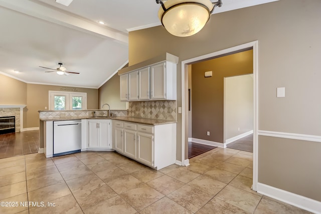 kitchen featuring dishwasher, a ceiling fan, ornamental molding, decorative backsplash, and a sink