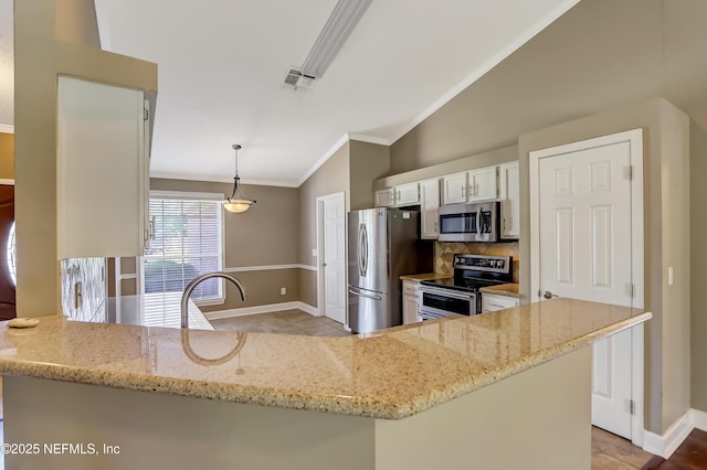 kitchen with stainless steel appliances, vaulted ceiling, baseboards, light tile patterned flooring, and tasteful backsplash
