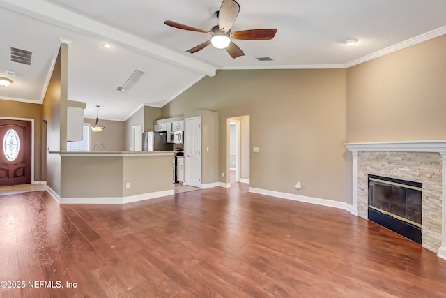 unfurnished living room featuring a ceiling fan, baseboards, wood finished floors, a fireplace, and ornamental molding