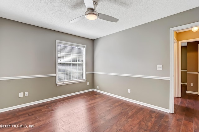 spare room with a ceiling fan, a textured ceiling, wood finished floors, and baseboards