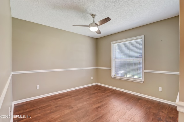unfurnished room featuring wood finished floors, a textured ceiling, baseboards, and ceiling fan