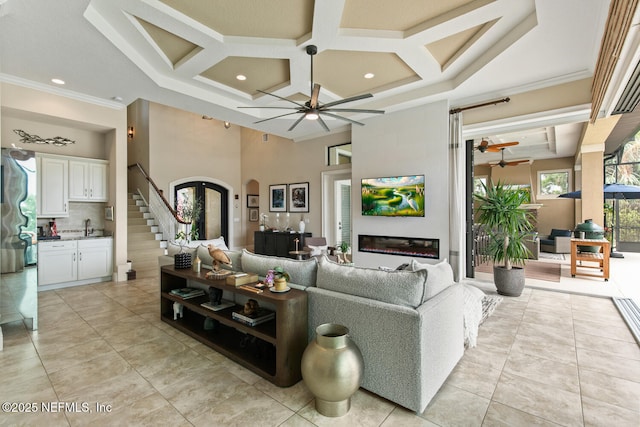 110 Heron Dr, Palm Coast, FL 32137 - living area featuring a ceiling fan, coffered ceiling, light tile patterned floors, beam ceiling, and recessed lighting