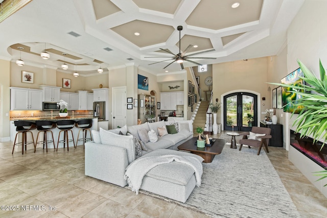 110 Heron Dr, Palm Coast, FL 32137 - living area featuring a towering ceiling, crown molding, coffered ceiling, french doors, and stairs