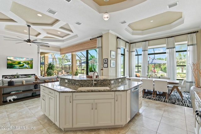 110 Heron Dr, Palm Coast, FL 32137 - kitchen with a sink, an island with sink, stone countertops, a ceiling fan, and open floor plan